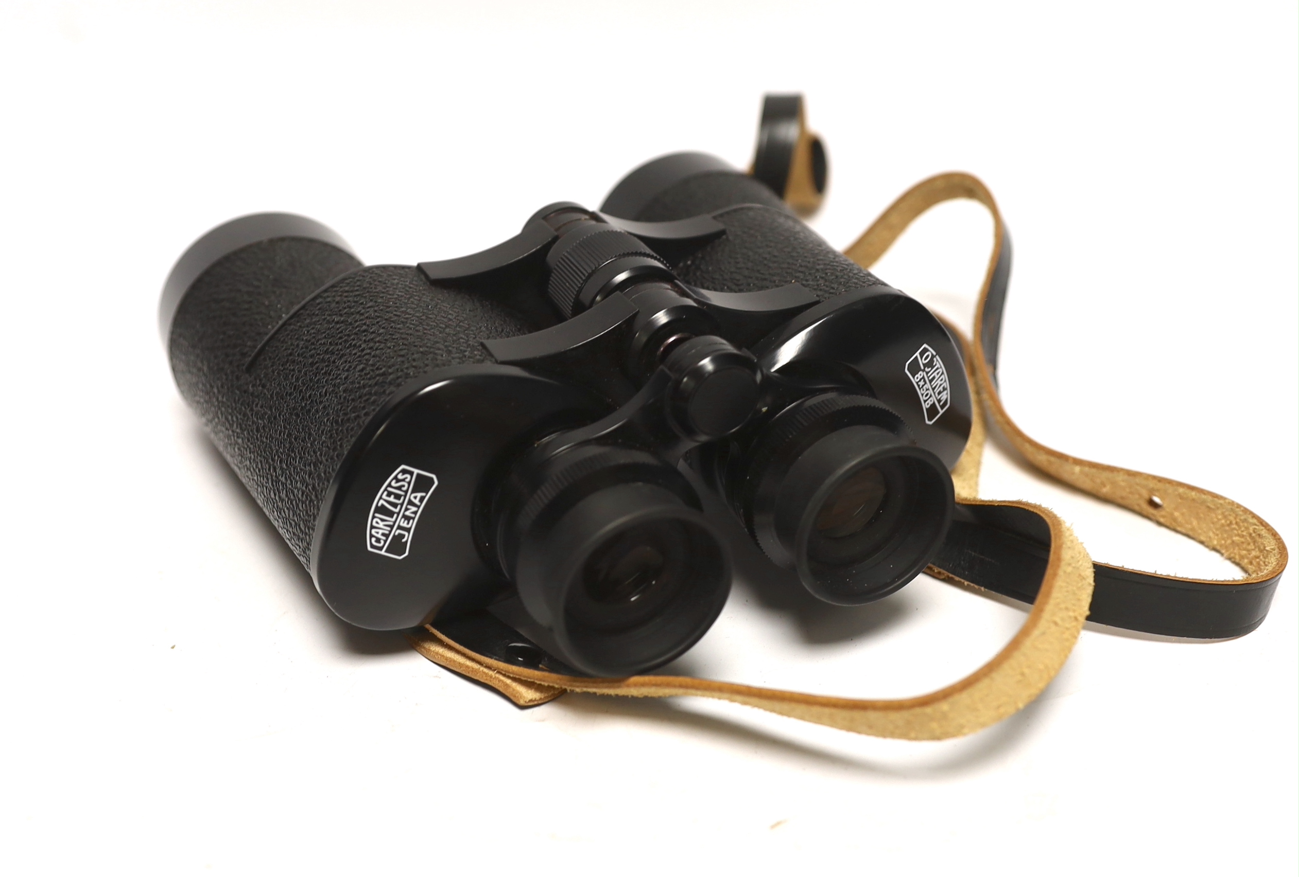 A pair of Zeiss Octarem 8X50B binoculars in a leather case with strap